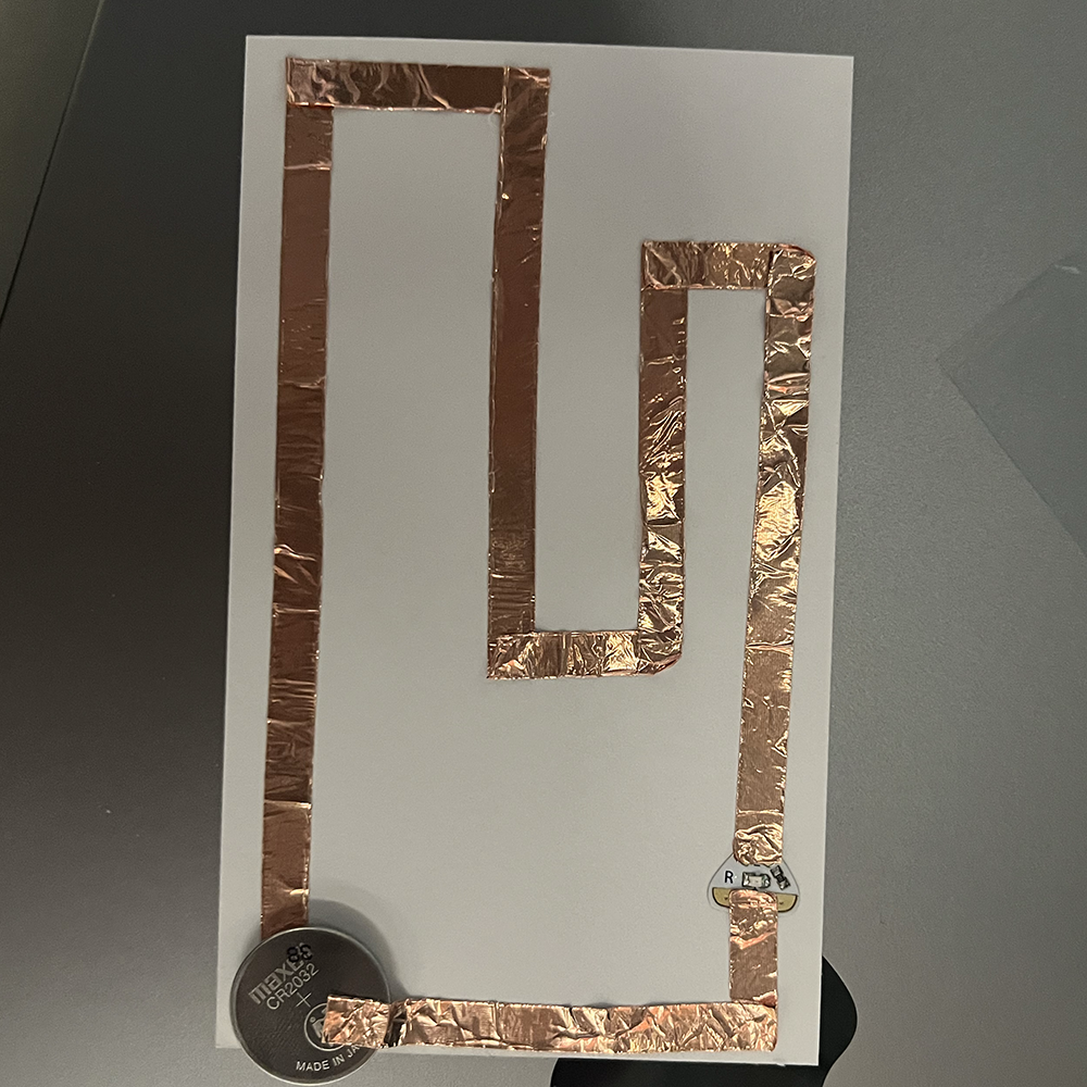 Making test of low voltage electricity through complex pathway using copper tap #2.